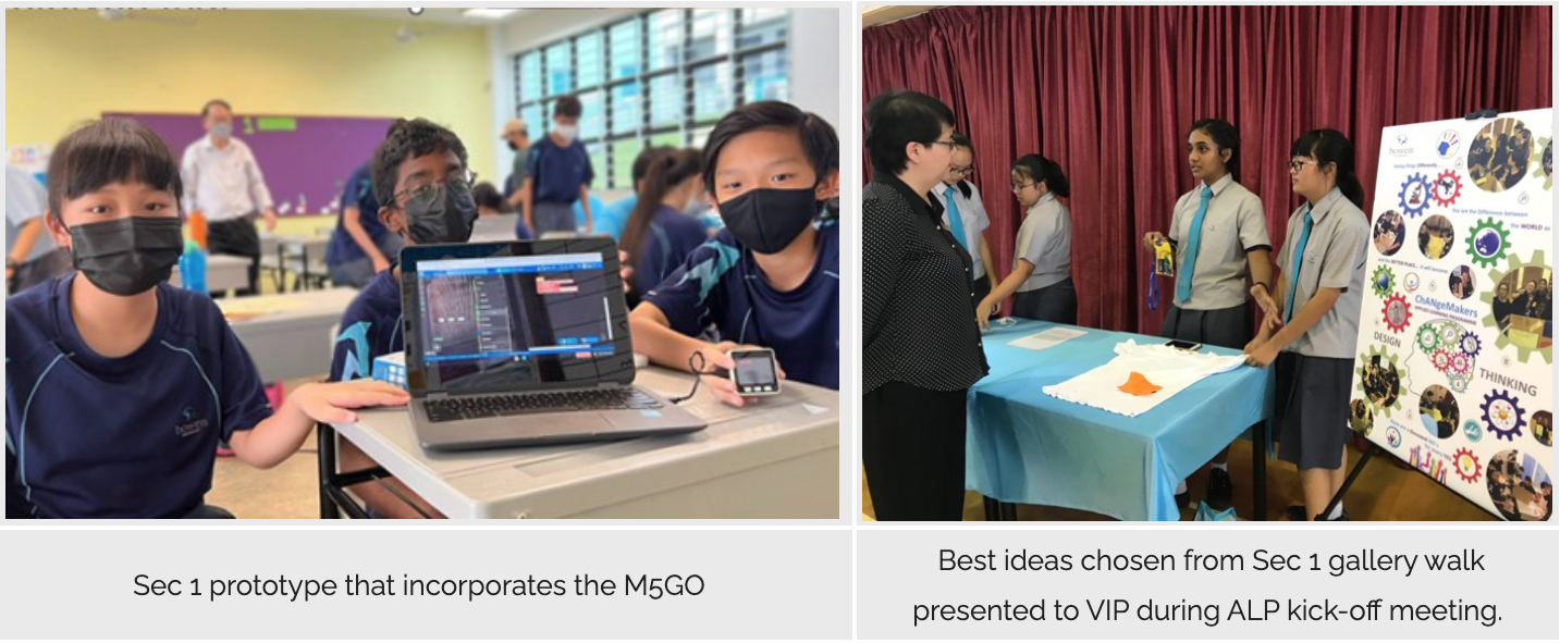 Students in masks work on a laptop prototype, while others present a project board to a visitor at a school event.